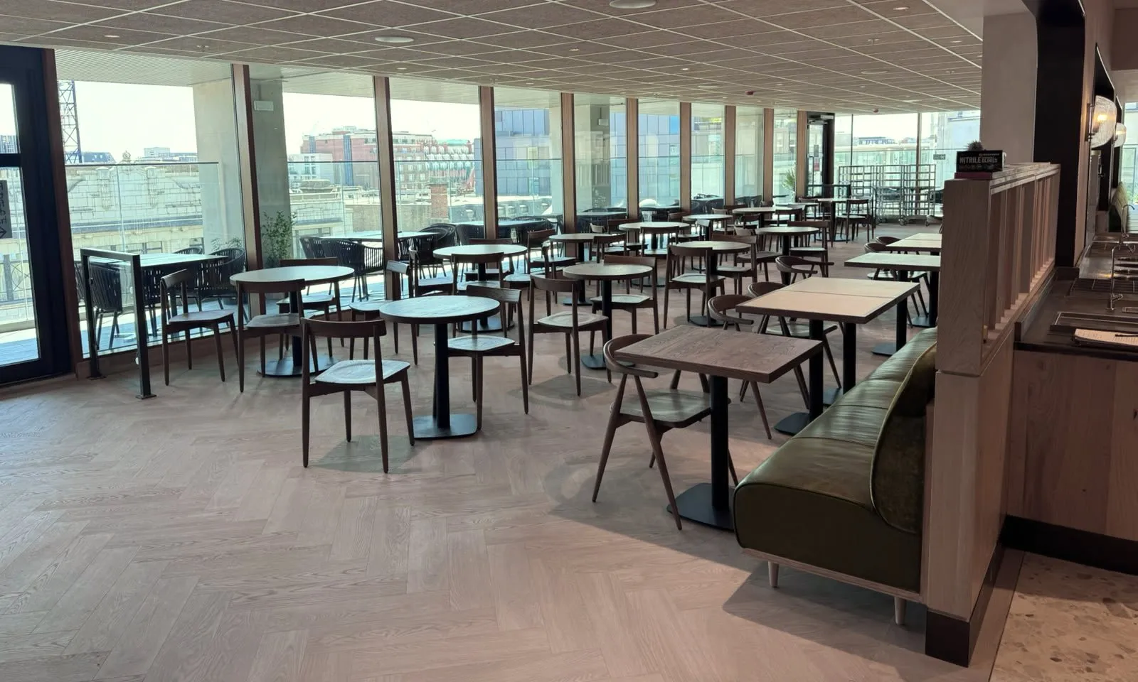 Pale herringbone LVT across the window dining room at Platter, John Lewis Oxford Street