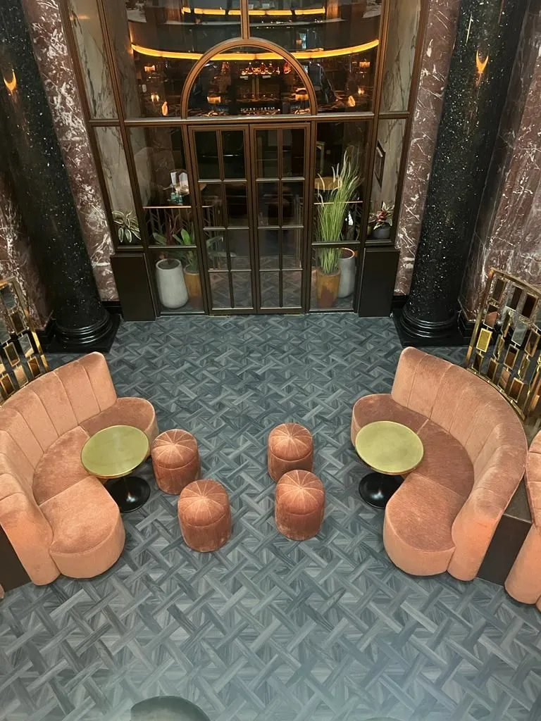 Grey basket-weave Amtico in the marble-columned bar lounge