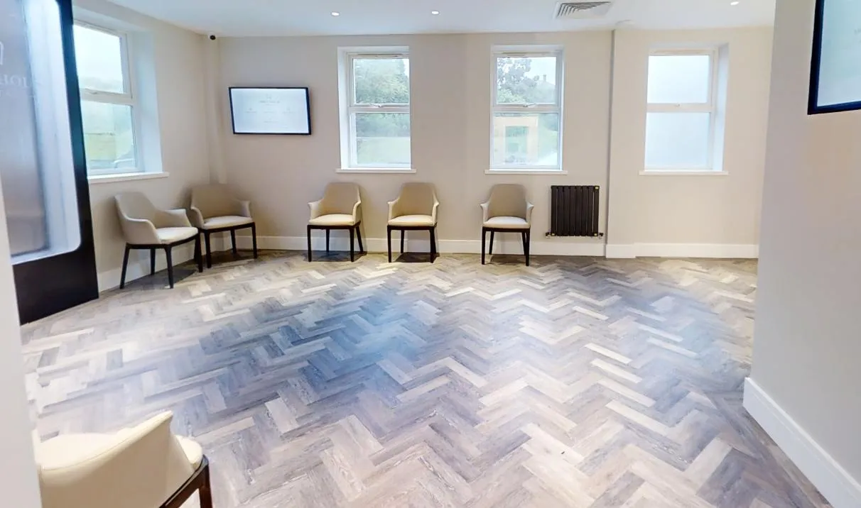 Herringbone LVT across the waiting room at Abbey House Dental